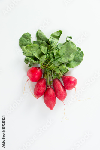 Red radishes on white background