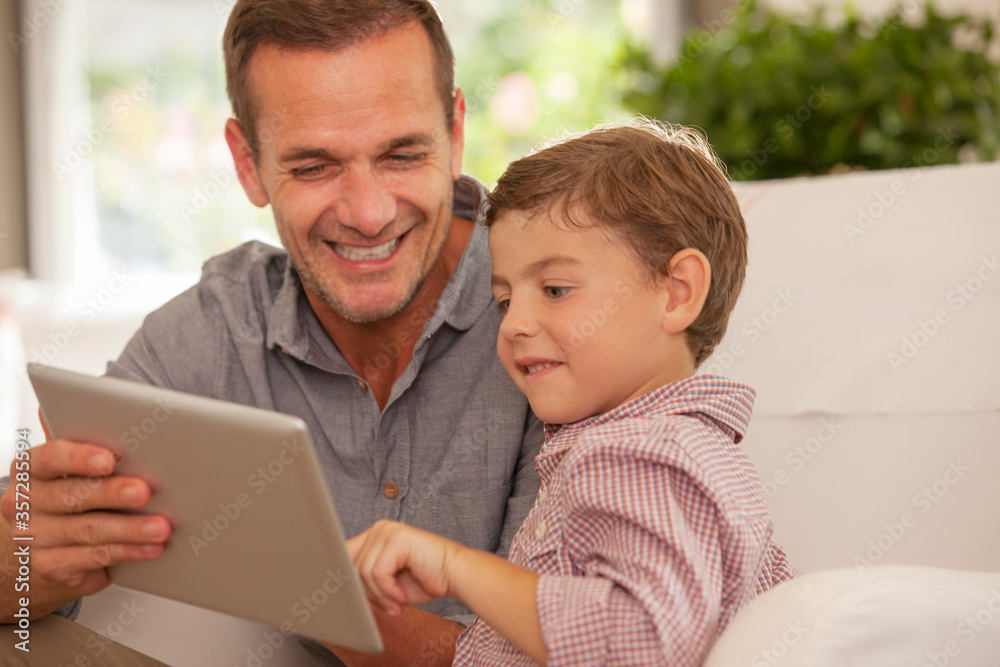 Father and son using digital tablet Father and son using digital tablet