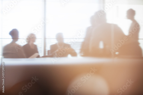 Silhouette of business people in meeting