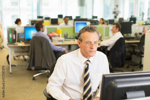 Businessman working at computer in office