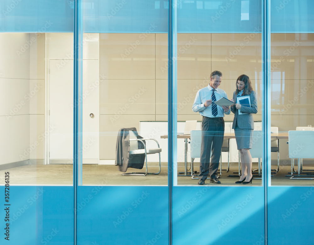 Business people talking in conference room Business people talking in conference room