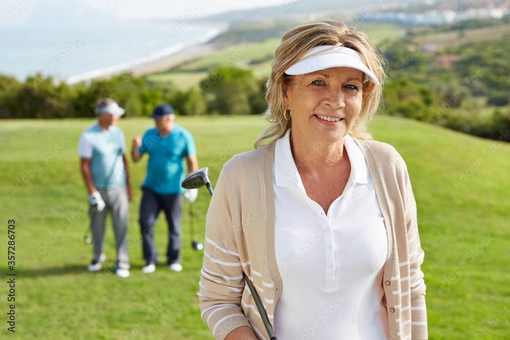 Senior friends on golf course Senior friends on golf course