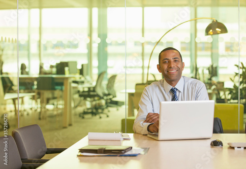 Businessman smiling at desk