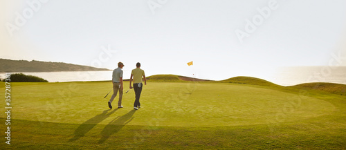Wallpaper Mural Men walking on golf course Torontodigital.ca