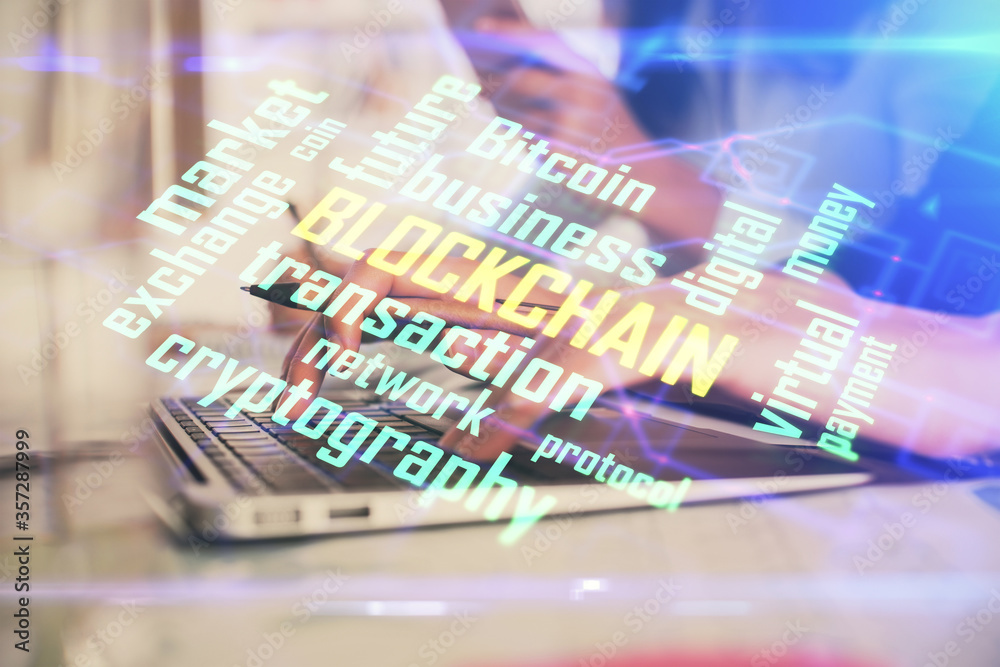 Fototapeta premium Double exposure of woman hands typing on computer and crypto market theme hologram drawing. Blockchain concept.