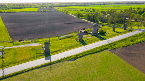 Beautiful panoramic aerial view photo from flying drone to summer fields and Angla windmills in Leisi Parish. Saarema Island, Estonia. (series)