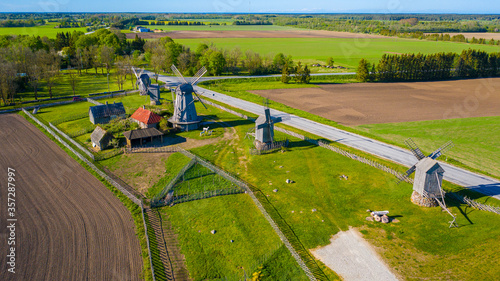 Beautiful panoramic aerial view photo from flying drone to summer fields and Angla windmills in Leisi Parish. Saarema Island, Estonia. (series) photo