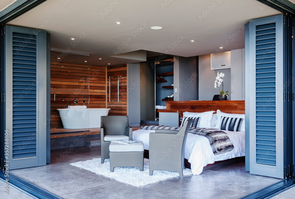 Naklejka premium Patio doors open to modern bedroom