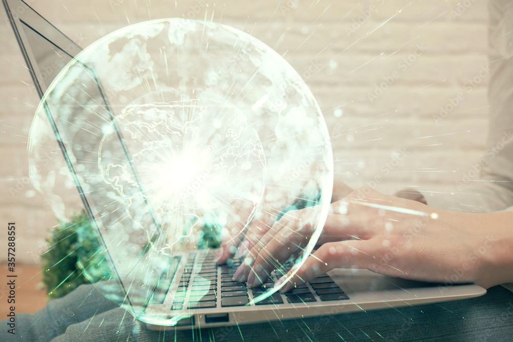 Double exposure of woman hands typing on computer and business theme hologram drawing. Success concept. Double exposure of woman hands typing on computer and business theme hologram drawing. Success concept.