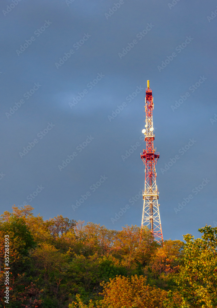 radio tower on a hill on evening sky background