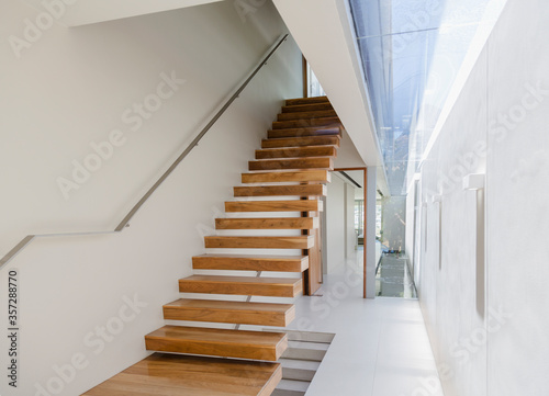 Floating staircase and corridor in modern house photo