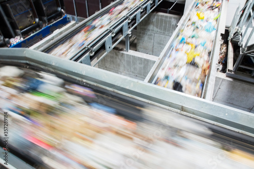 Blurred view of conveyor belts in recycling center photo