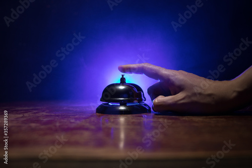 Hotel reception bell, service bell on the table, selective focus