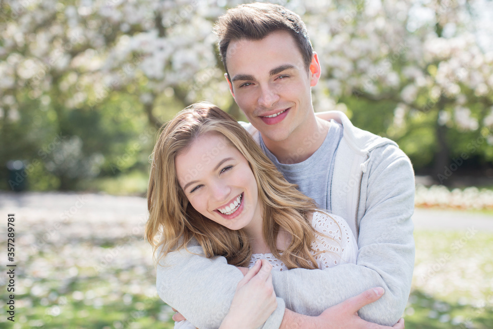 Couple hugging outdoors