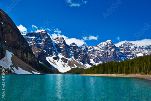 Snowy mountains overlooking glacial lake