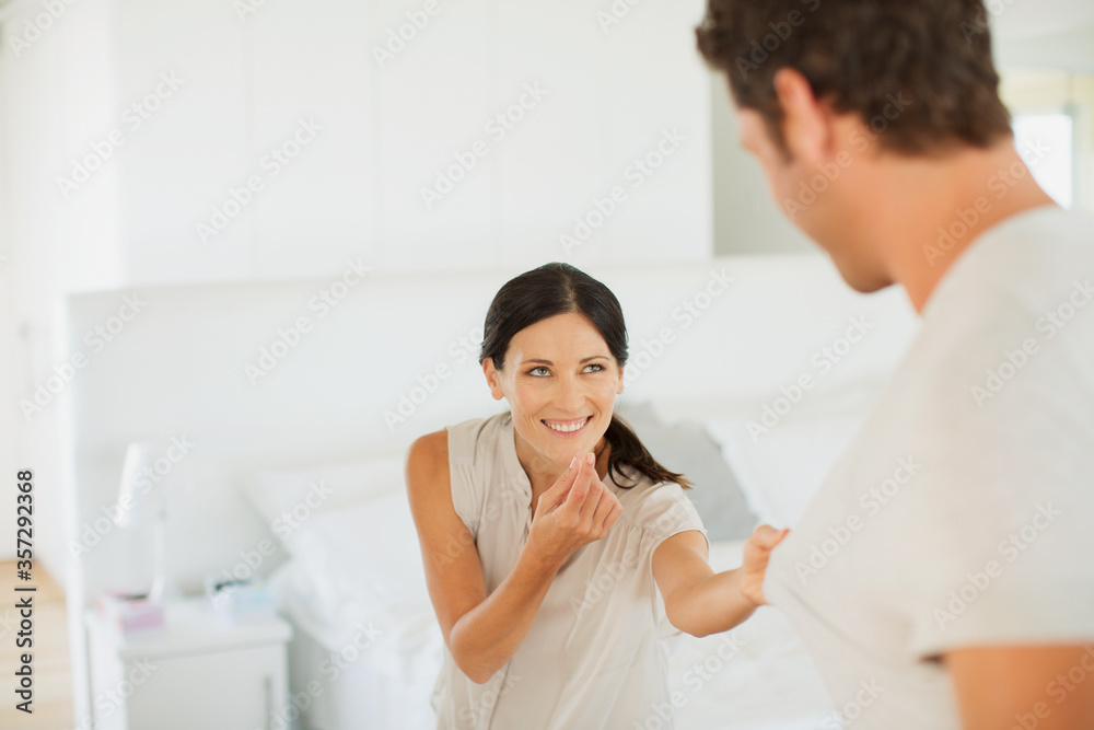 Couple playing together in bedroom Couple playing together in bedroom