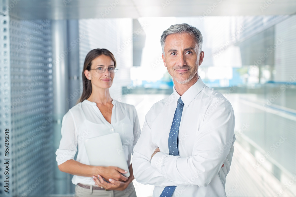 Portrait of confident business people in office Portrait of confident business people in office