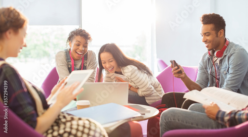 University students using technology in lounge