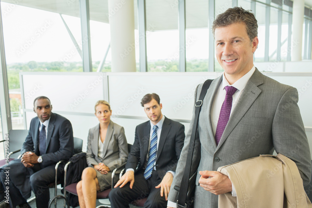 Fototapeta premium Businessman smiling in office