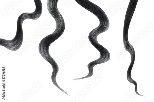 Black hair on white background, isolated. Thin curly threads