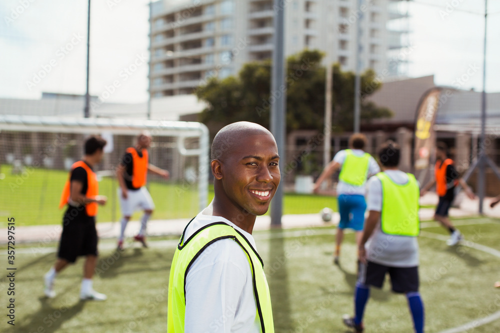 Fototapeta premium Soccer player smiling on field