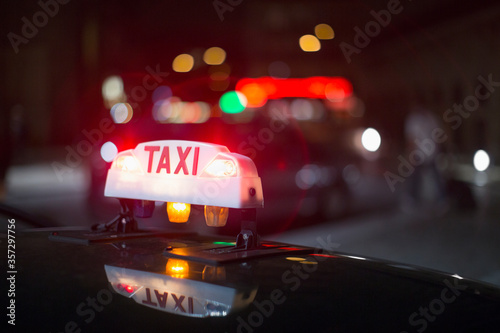 Close up of illuminated Parisian taxi light, Paris, France photo