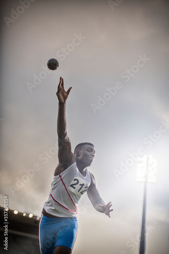 Fototapeta Naklejka Na Ścianę i Meble -  Track and field athlete throwing shot put