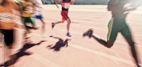 Runners racing on track © Tom Merton/KOTO
