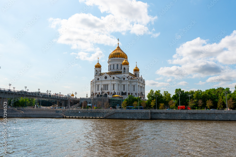 Fototapeta premium Cathedral of christ the savior in Moscow Russia, shot at bright summer day. Russian orthodox architecture style with golden top. 