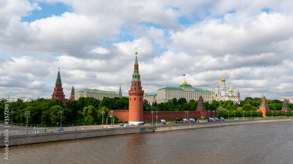 View to the Moscow Kremlin next to the river at cloudy day, summer time shot. Historical heritage of Russia.  