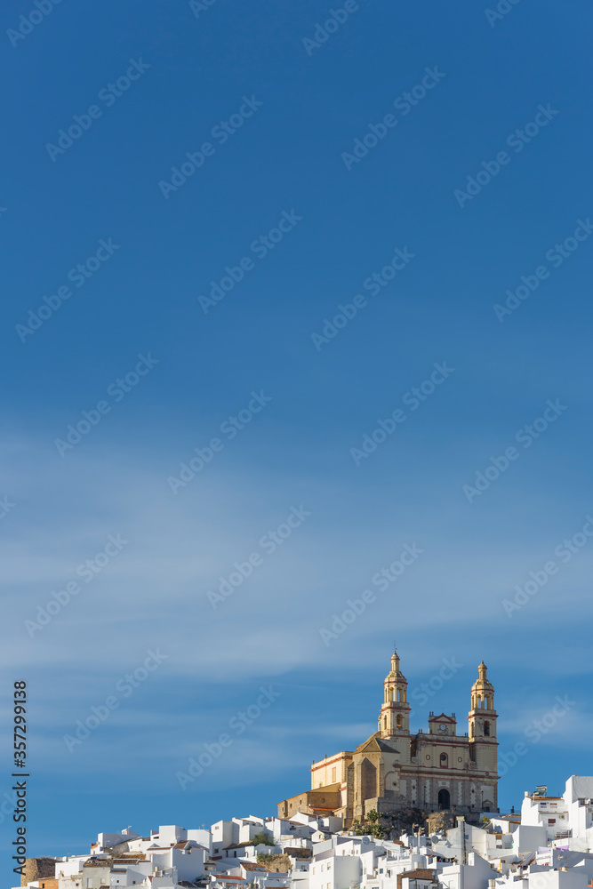 Parish of our Lady of the Incarnation on hilltop under blue sky, Olvera, Andalucia, Spain