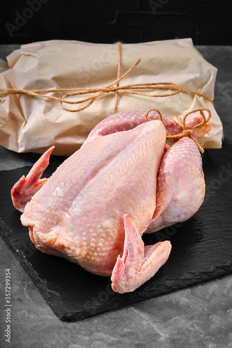 Chicken carcass raw meat ready for cooking. Ecological packaging. Organic products, layout for a healthy diet and organic restaurant cooking advertisement photo