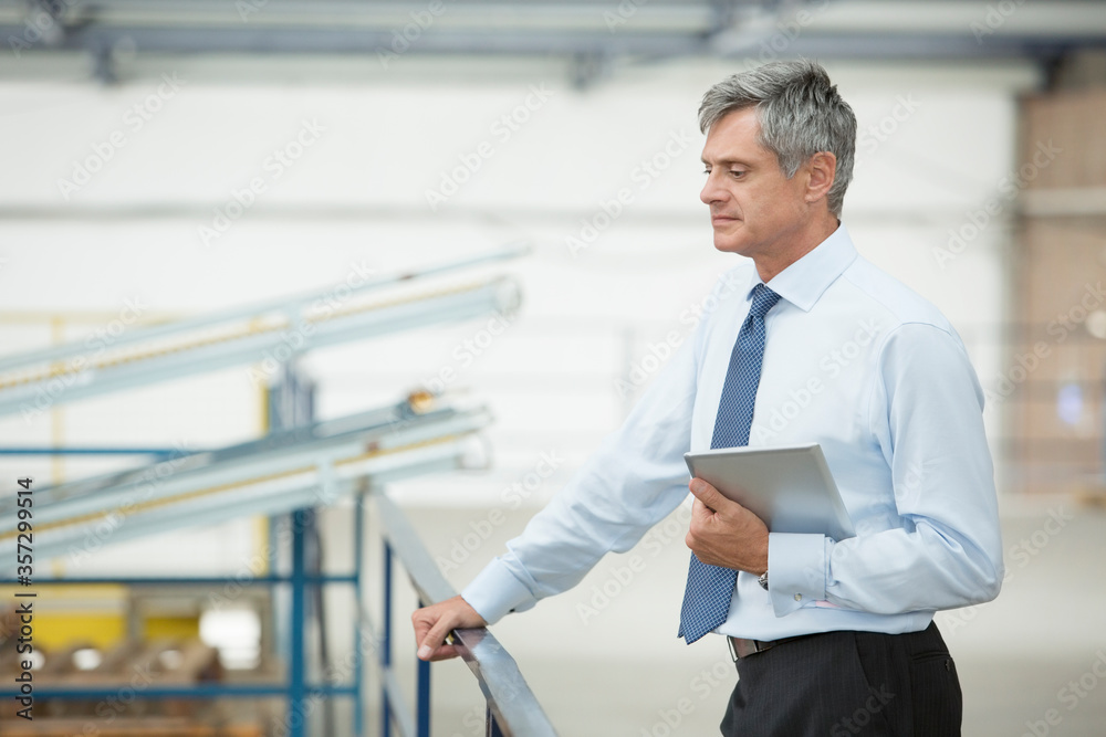 Fototapeta premium Supervisor with digital tablet in food processing plant