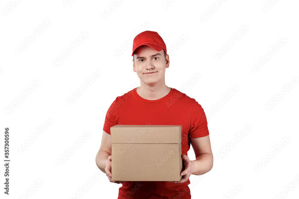 A young guy from the delivery service with a parcel, a box in his hands. A young guy from the delivery service with a parcel, a box in his hands.