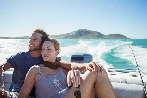 Couple sitting on boat together © Robert Daly/KOTO