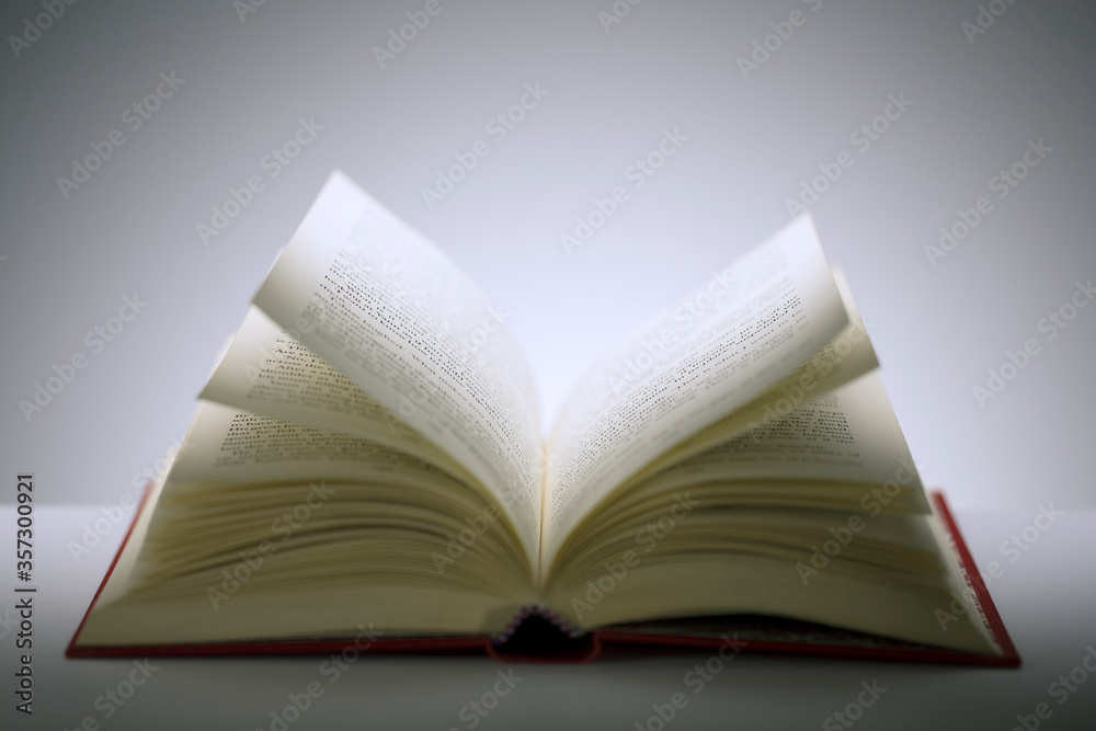 Fototapeta premium Close up of open book on counter