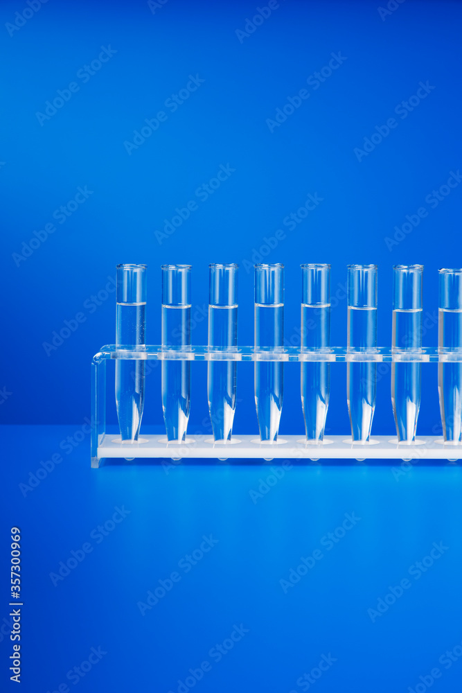 Rack of test tubes with solution on blue counter