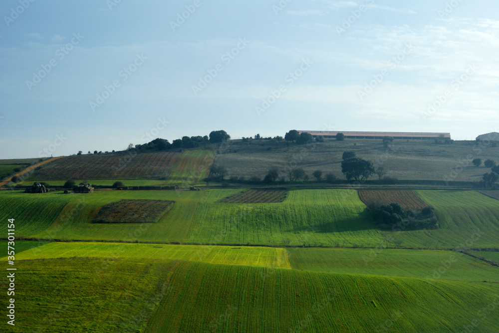 Aerial landscape view of green grass fields on the afternoon on the way to Galicia Spain 