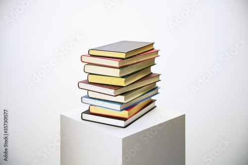 Stack of books on pedestal