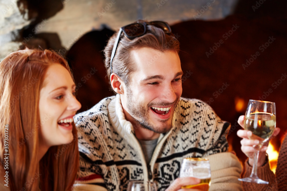 Couple enjoying drinks with friends