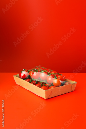 Close up of tomatoes shrink wrapped in plastic photo