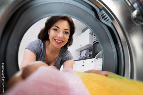 Woman Using Washing Machine Appliance