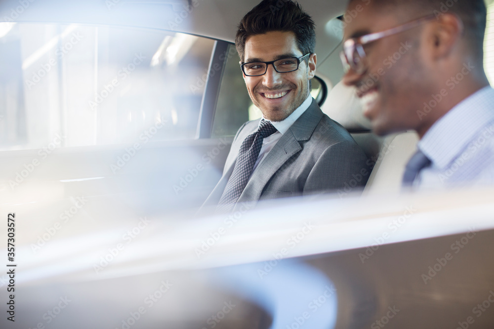 Businessmen sitting in car back seat Businessmen sitting in car back seat