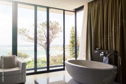 Luxurious bathroom with beautiful view on coast © Astronaut Images/KOTO