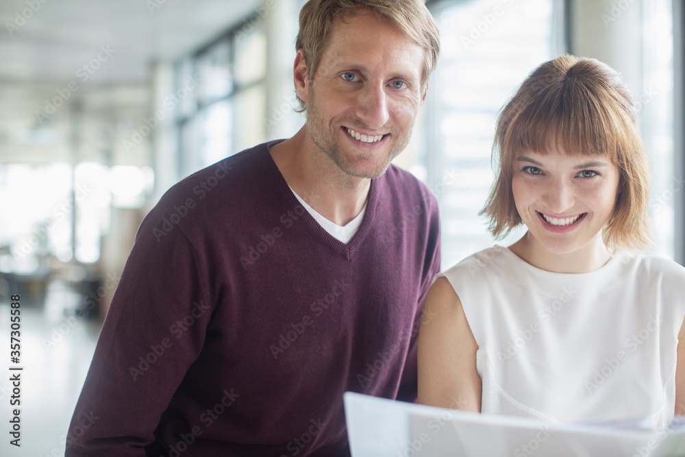 Business people smiling in office Business people smiling in office