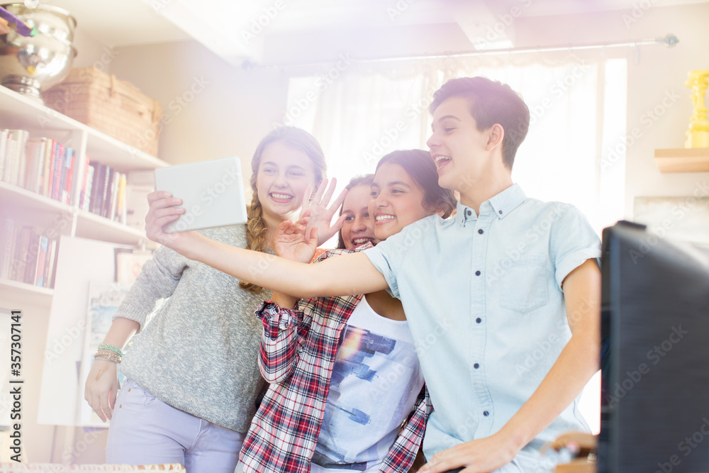 Teenagers taking selfie with digital tablet in room Teenagers taking selfie with digital tablet in room