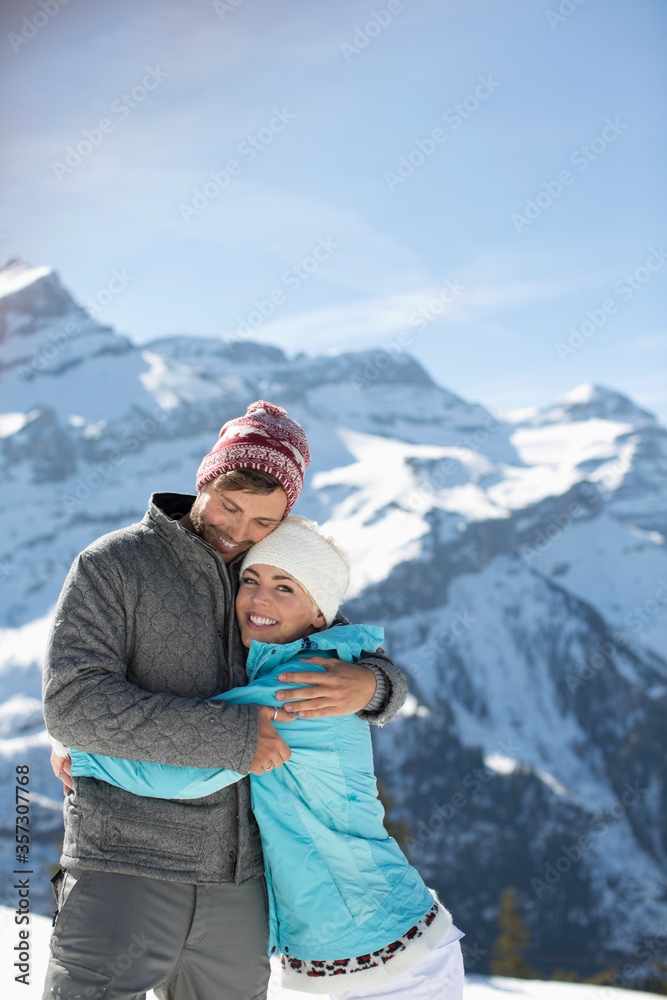 Couple hugging at mountains