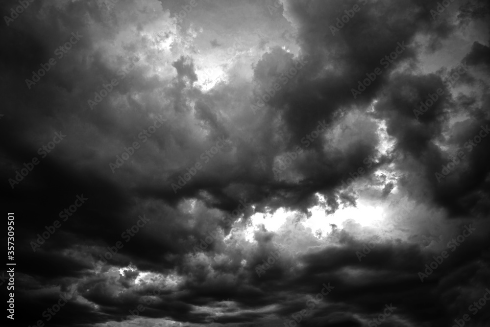 Black clouds formed before storm and the rain. Black and white. Black clouds formed before storm and the rain. Black and white.