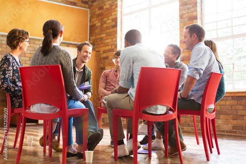 People talking in group therapy session