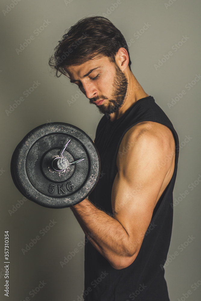 muscular man lifting weights muscular man lifting weights